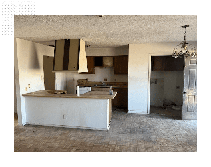 A kitchen with an island and a stove in it.